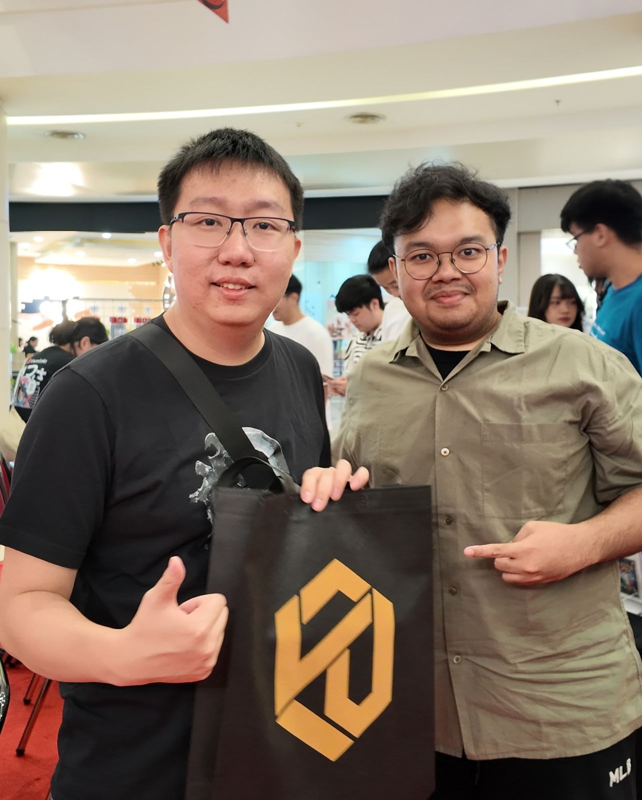Collector holding a Legacy Vault extended art case out in the city